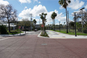 photo of downtown Fort Lauderdale streetscape after reconstruction shows narrower street wide sidewalk and trees